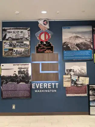 A local history display board headed Everett, Washington, with archive photographs and a Mount Rainier panel.