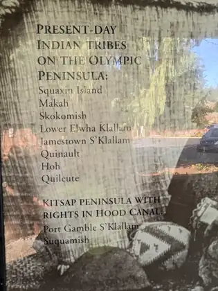 A sign listing the present-day tribes of the Olympic Peninsula, from Squaxin Island, Makah and Skokomish to Quinault, Hoh and Quileute, and those of the Kitsap Peninsula with rights in Hood Canal, Port Gamble S’Klallam and Suquamish.