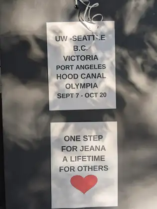 A welcome sign on a door traces the route from Seattle through British Columbia and Vancouver Island to Olympia and reads, One step for Jeana. A lifetime for others.